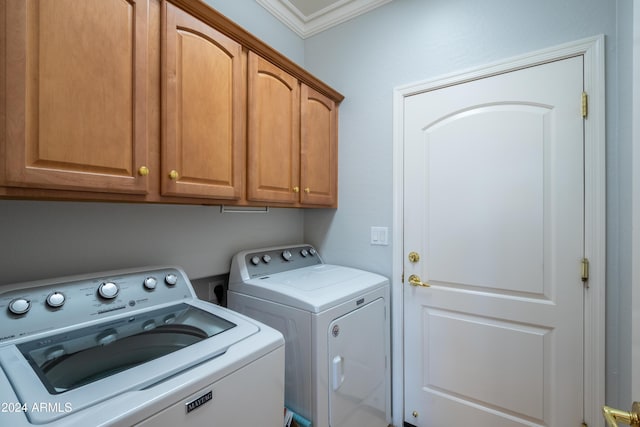 clothes washing area featuring separate washer and dryer, ornamental molding, and cabinets