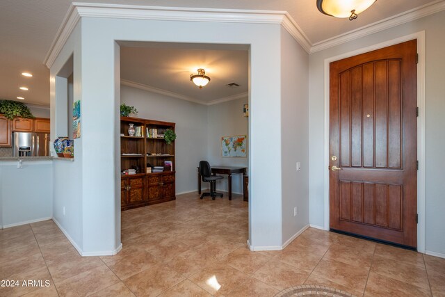 tiled entryway with crown molding