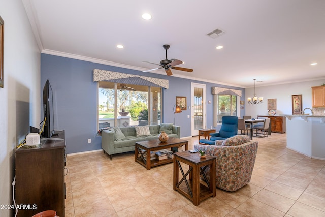 living room featuring light tile patterned floors, ceiling fan with notable chandelier, and ornamental molding