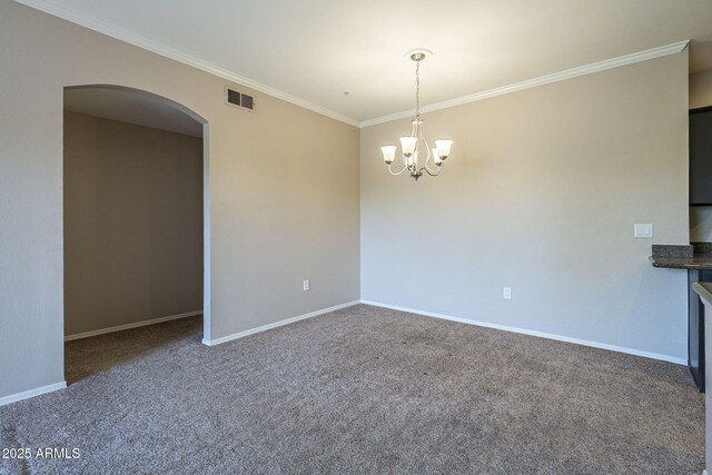 5345 E Van Buren St Unit 305, Phoenix, AZ 85008 - unfurnished room featuring ornamental molding, arched walkways, a chandelier, carpet, and baseboards