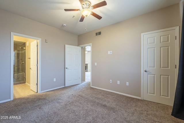 5345 E Van Buren St Unit 305, Phoenix, AZ 85008 - unfurnished bedroom featuring carpet floors, baseboards, ensuite bath, and ceiling fan