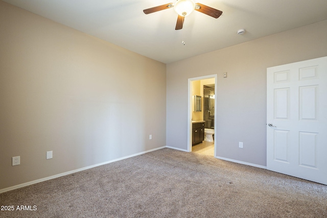 5345 E Van Buren St Unit 305, Phoenix, AZ 85008 - unfurnished bedroom featuring light colored carpet, baseboards, ensuite bathroom, and ceiling fan