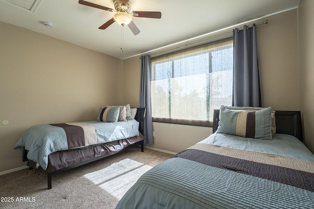 5345 E Van Buren St Unit 305, Phoenix, AZ 85008 - bedroom with carpet floors, baseboards, and a ceiling fan