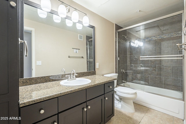 5345 E Van Buren St Unit 305, Phoenix, AZ 85008 - full bath with vanity, toilet, tile patterned flooring, and combined bath / shower with glass door