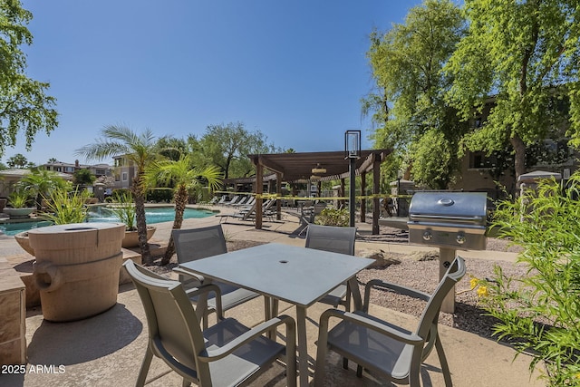 5345 E Van Buren St Unit 305, Phoenix, AZ 85008 - view of patio with an outdoor pool, outdoor dining space, and a grill
