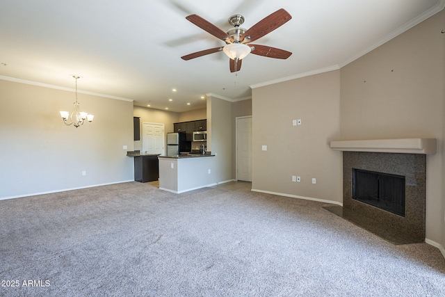 5345 E Van Buren St Unit 305, Phoenix, AZ 85008 - unfurnished living room with light colored carpet, a chandelier, ornamental molding, a fireplace with flush hearth, and baseboards