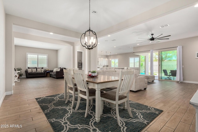5314 N 182nd Ln, Litchfield Park, AZ 85340 - dining room with light wood-style flooring, a chandelier, ceiling fan, and recessed lighting