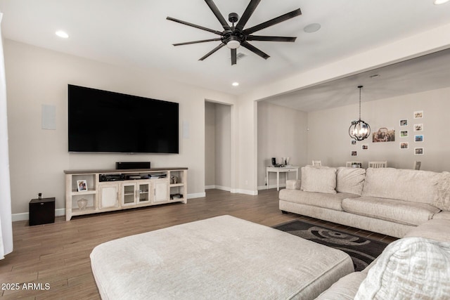 5314 N 182nd Ln, Litchfield Park, AZ 85340 - living room featuring a ceiling fan, wood finished floors, recessed lighting, and a chandelier