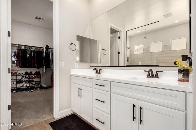 5314 N 182nd Ln, Litchfield Park, AZ 85340 - full bath with double vanity, tiled shower, wood finished floors, and a spacious closet
