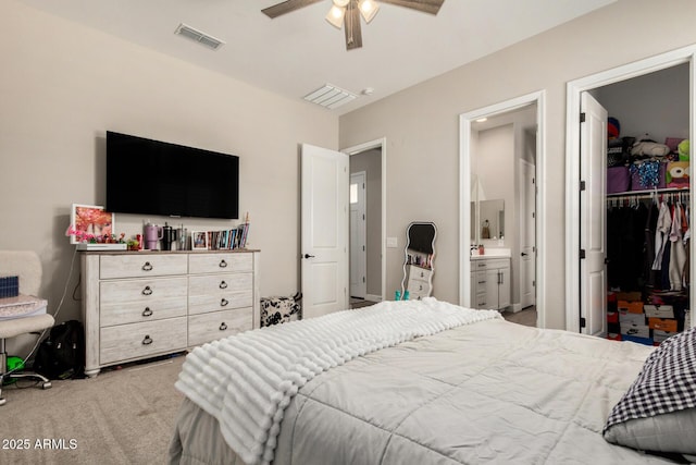 5314 N 182nd Ln, Litchfield Park, AZ 85340 - bedroom featuring carpet flooring, a spacious closet, ensuite bathroom, a closet, and ceiling fan