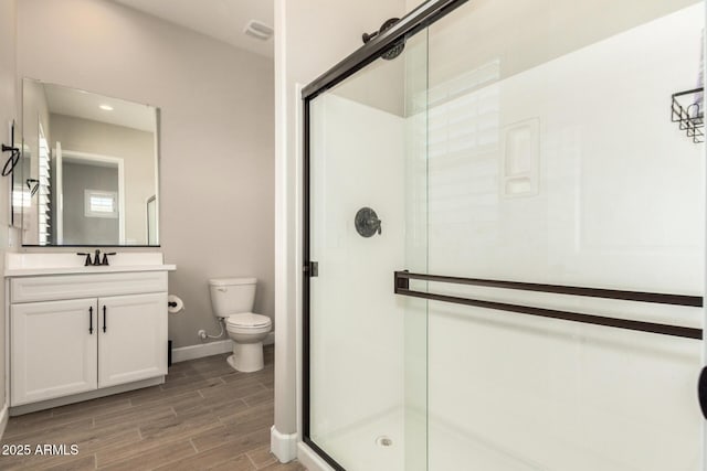 5314 N 182nd Ln, Litchfield Park, AZ 85340 - bathroom featuring a shower stall, wood finished floors, and vanity