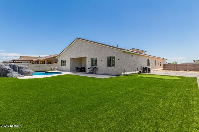 5314 N 182nd Ln, Litchfield Park, AZ 85340 - back of property with a fenced backyard, a patio area, an area to practice putting, and stucco siding