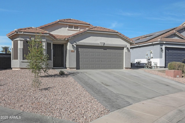 view of front of house with solar panels and a garage