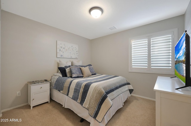 bedroom with light carpet