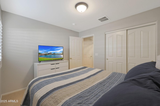 carpeted bedroom with a closet