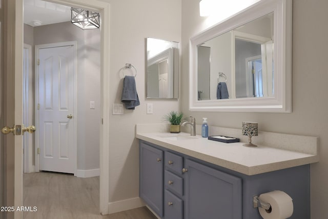 bathroom featuring hardwood / wood-style flooring and vanity