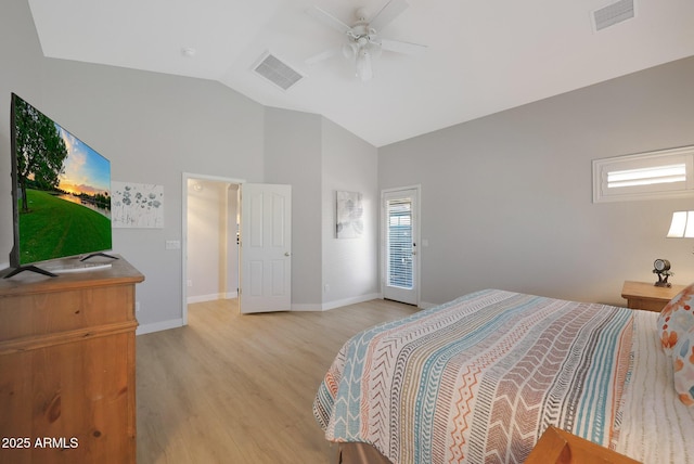 bedroom featuring ceiling fan, lofted ceiling, and light hardwood / wood-style flooring