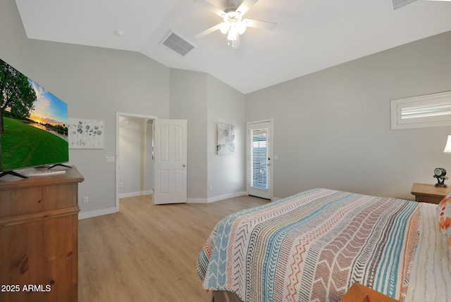 bedroom featuring ceiling fan, lofted ceiling, and light wood-type flooring