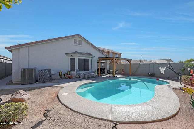 view of pool with central AC and a patio area