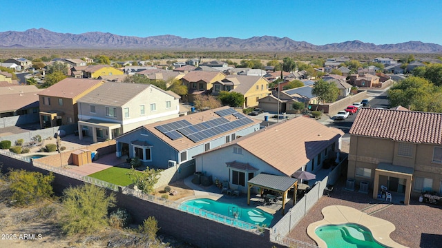 birds eye view of property featuring a mountain view