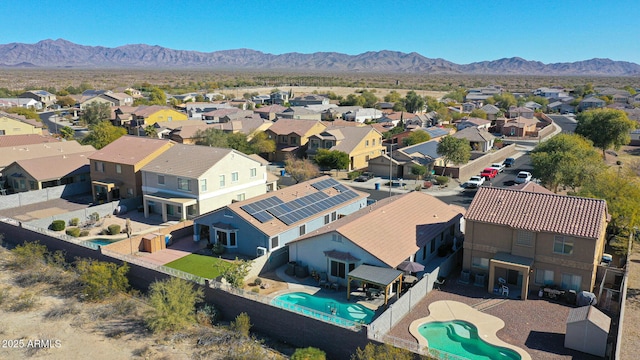 birds eye view of property with a mountain view