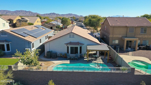 view of pool featuring a patio, a mountain view, a gazebo, and cooling unit