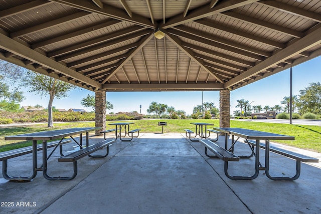 view of home's community with a yard, a gazebo, and a patio area