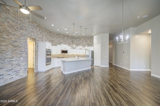 710 W Ardmore Rd, Phoenix, AZ 85041 - kitchen featuring appliances with stainless steel finishes, a chandelier, open floor plan, light countertops, and ceiling fan