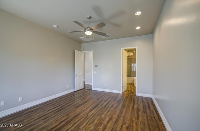 710 W Ardmore Rd, Phoenix, AZ 85041 - unfurnished bedroom featuring dark wood-type flooring, baseboards, recessed lighting, ensuite bathroom, and a ceiling fan