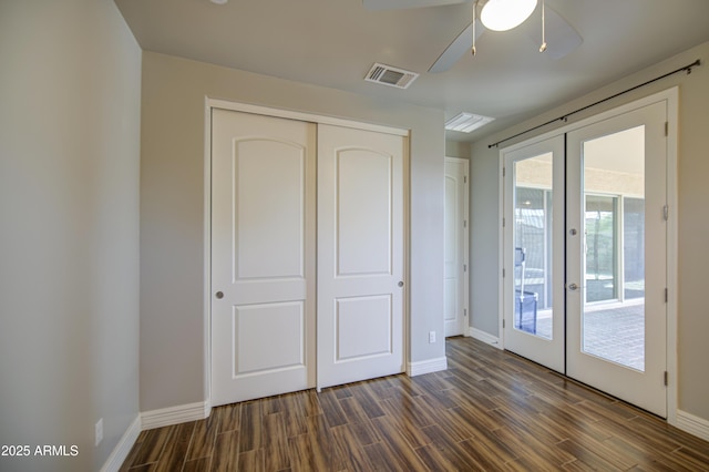 710 W Ardmore Rd, Phoenix, AZ 85041 - unfurnished bedroom featuring french doors, access to outside, baseboards, dark wood-type flooring, and a closet