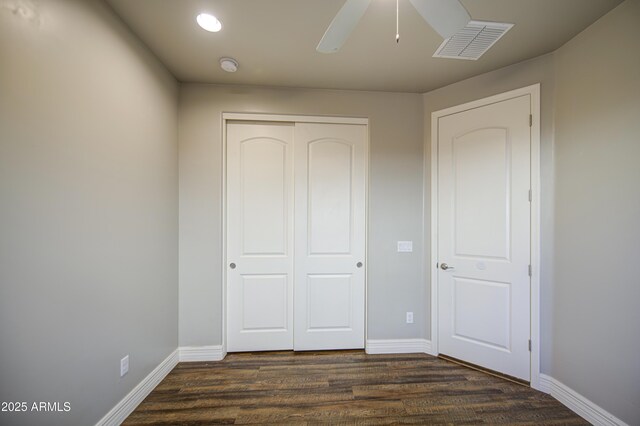 710 W Ardmore Rd, Phoenix, AZ 85041 - unfurnished bedroom featuring a closet, dark wood-type flooring, baseboards, and recessed lighting