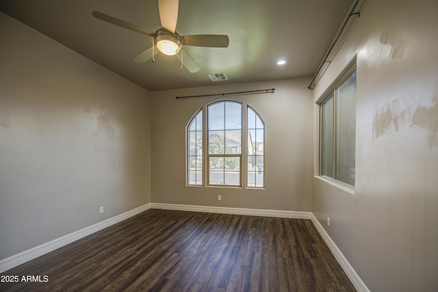 710 W Ardmore Rd, Phoenix, AZ 85041 - spare room featuring dark wood-style flooring, baseboards, ceiling fan, and recessed lighting
