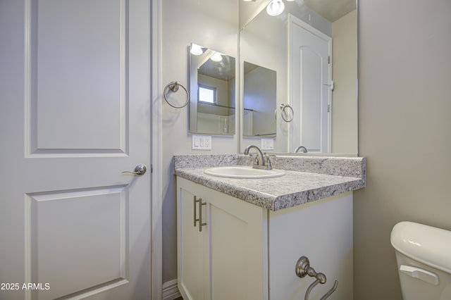 710 W Ardmore Rd, Phoenix, AZ 85041 - half bathroom featuring toilet and vanity