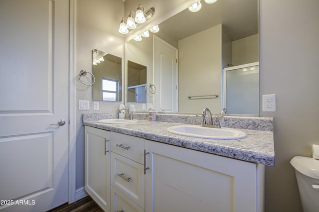 710 W Ardmore Rd, Phoenix, AZ 85041 - full bath with double vanity, a shower with shower door, and toilet