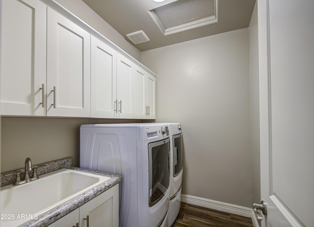 710 W Ardmore Rd, Phoenix, AZ 85041 - laundry room with washing machine and clothes dryer, cabinet space, baseboards, dark wood-style flooring, and attic access