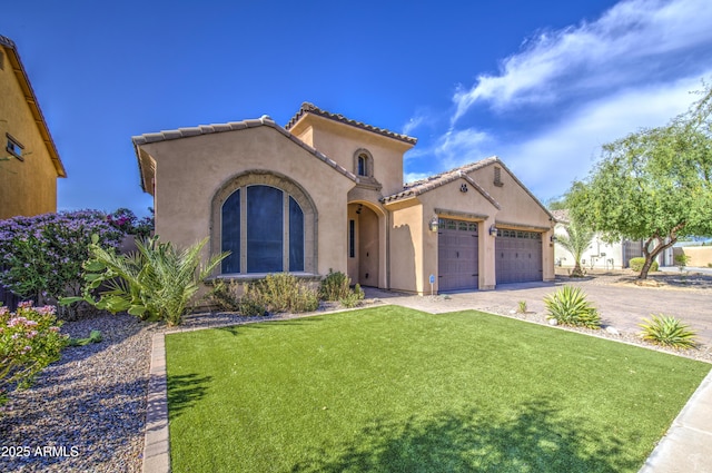 710 W Ardmore Rd, Phoenix, AZ 85041 - mediterranean / spanish-style home featuring a garage, stucco siding, a front lawn, a tiled roof, and driveway