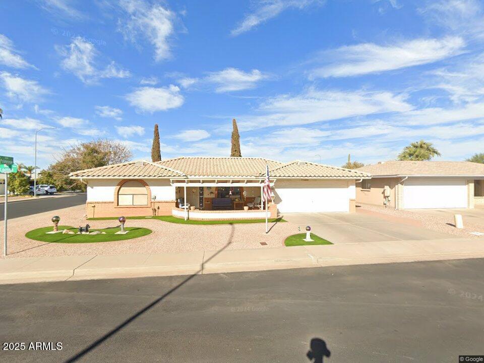 8242 E Lomita Ave, Mesa, AZ 85209 - ranch-style home featuring a tile roof, driveway, an attached garage, and stucco siding