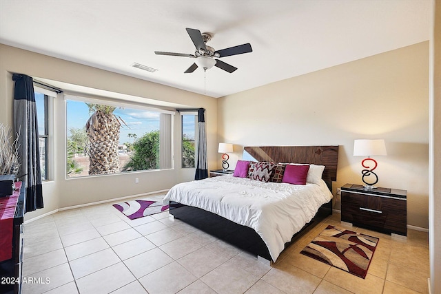 tiled bedroom with ceiling fan