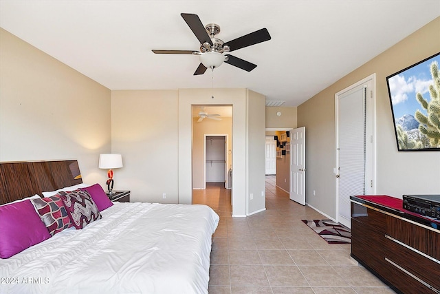 bedroom featuring ceiling fan and light tile flooring