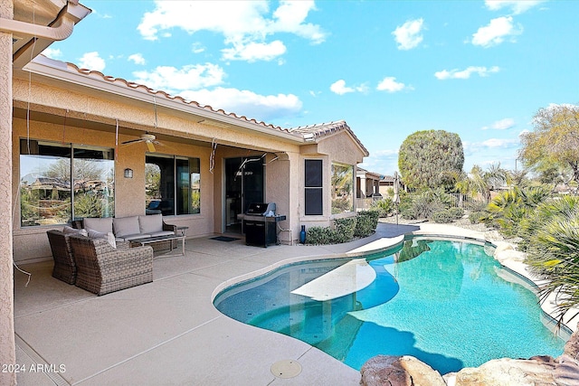 view of pool featuring an outdoor living space, ceiling fan, and a patio