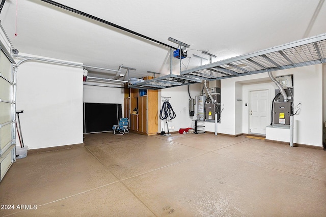 garage with gas water heater, heating utilities, and a garage door opener