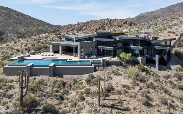 9643 E Cintarosa Pass, Scottsdale, AZ 85262 - view of swimming pool with a patio area, a mountain view, and an infinity pool