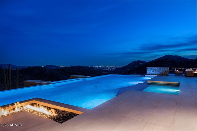 9643 E Cintarosa Pass, Scottsdale, AZ 85262 - view of swimming pool featuring an infinity pool, a patio area, a fire pit, and a mountain view