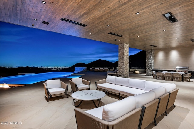 9643 E Cintarosa Pass, Scottsdale, AZ 85262 - view of patio with an outdoor pool, outdoor lounge area, area for grilling, and an outdoor kitchen