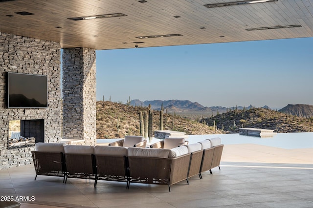 9643 E Cintarosa Pass, Scottsdale, AZ 85262 - view of patio / terrace featuring an outdoor living space and a mountain view