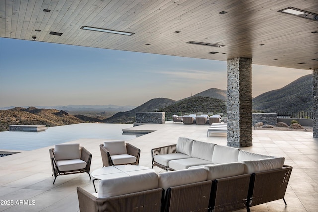 9643 E Cintarosa Pass, Scottsdale, AZ 85262 - view of patio featuring an outdoor living space and a mountain view