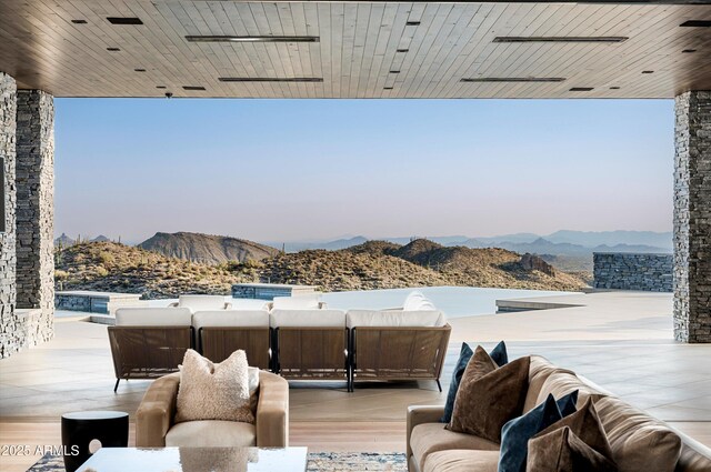 9643 E Cintarosa Pass, Scottsdale, AZ 85262 - view of patio / terrace featuring an outdoor living space and a mountain view