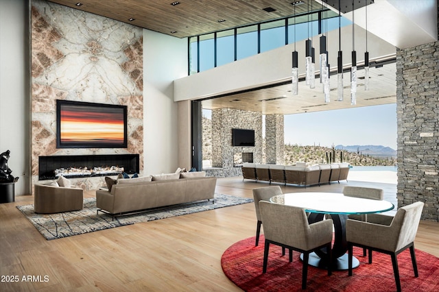 9643 E Cintarosa Pass, Scottsdale, AZ 85262 - interior space with a towering ceiling, wood finished floors, and a premium fireplace