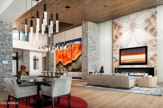 9643 E Cintarosa Pass, Scottsdale, AZ 85262 - interior space with a fireplace, a towering ceiling, wood ceiling, and wood finished floors
