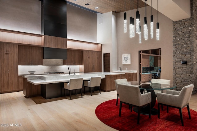 9643 E Cintarosa Pass, Scottsdale, AZ 85262 - dining room featuring light wood-type flooring and a towering ceiling